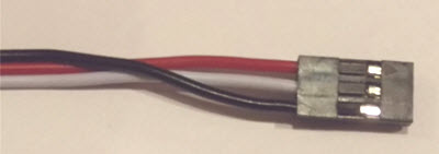 Re-arrange the wires in the plastic connector so they order RED-WHITE-BLACK.