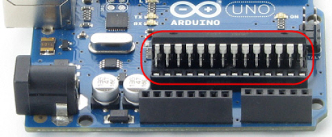Digital and analog pins on an Arduino Uno module, close-up