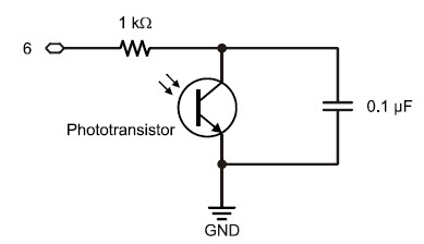 Phototransistor charge-transfer or QT circuit, with a 1 k-ohm resistor connected in parallel with the phototransistor