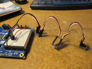 RGB LEDs connected to the breadboard and each other using 3-pin extension cables.