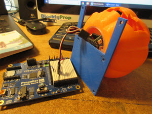 RGB LED string being placed into the pumpkin head.