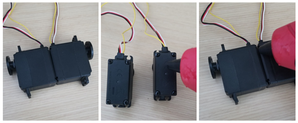 Gluing the two servos back to back.