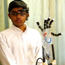 Shiva with his winning prosthetic hand project.